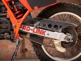 a close up of a motorcycle with a chain attached to it