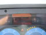 a close up of a car dashboard with a clock on it