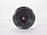 a black camera lens on a white background
