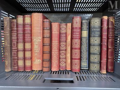 many old books on a shelf in a book case