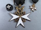 two medals and a medal on a table