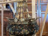 a large metal object that is on a stand in a room
