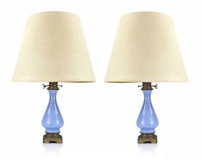 pair of blue glass table lamps with brass bases and shades