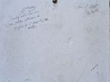 graffiti on the wall of a building with writing on it