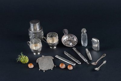 a lot of silver objects on a black surface
