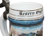 a beer mug with a handle that has a picture on it