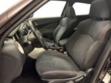 the interior of a car with black leather seats and a steering wheel