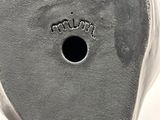 the bottom of a pair of shoes with a hole in the sole