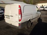 a white van that is parked in a parking lot