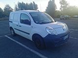 a white van that is parked in a parking lot