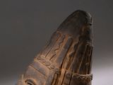 an image of a wooden sculpture of a person ' s face