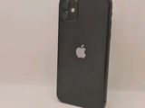 the back of a black iphone with an apple logo on it