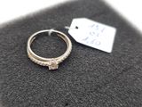 a ring that is sitting on top of a black cloth