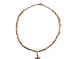 a close up of a necklace with a cross on it
