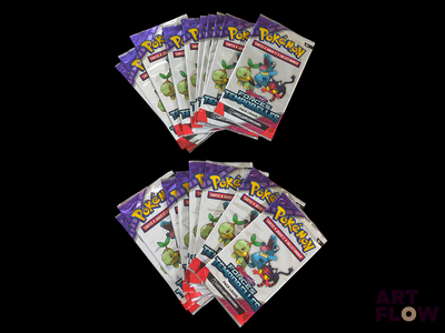 five packs of pokemon trading cards on a black background