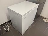 an image of a small white refrigerator in a kitchen
