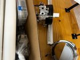 a cardboard box with a sewing machine and other items on a table