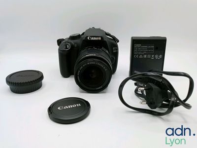 a camera with a lens and a battery attached to it