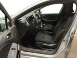 the interior of a car with the door open and the driver ' s seat down
