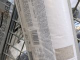 a bag of rice sitting on top of a shopping cart