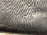 black fabric with a small hole in the middle of it