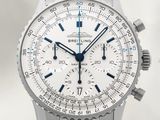 the watch is white and has a blue second hand