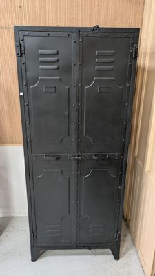 black metal locker cabinet with doors open in a room