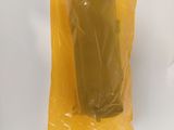a chocolate bar in a plastic bag on a white surface