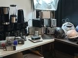 many different types of coffee machines on the table