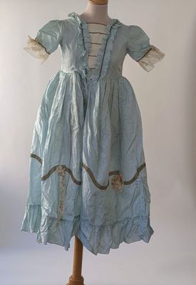 an image of a blue dress on a mannequin stand