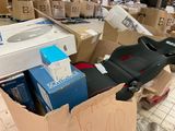 a cardboard box with a seat and a box of boxes on the floor