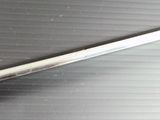 a close up of a knife on a metal surface