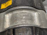 a close up of a metal object with a yellow tag on it