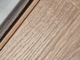 a close up of a piece of wood on the floor