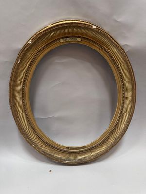 a close up of a gold picture frame on a white background