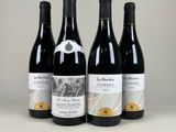 three bottles of wine are lined up on a table