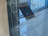 a clear display case with a book on it