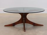an image of a glass table with a wooden base
