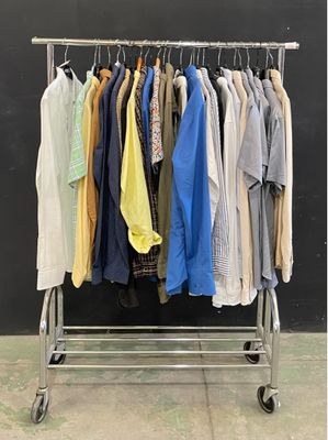 a rack of clothes that is hanging on a rail