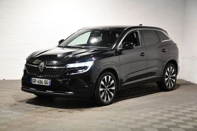a black suv parked in a garage with a checkered floor
