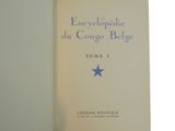an old book with a blue star on it sitting on top of a table