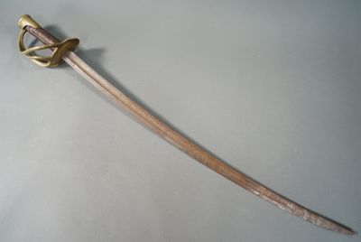 a very long sword that is on display on the table