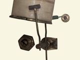 a lamp that is on top of a wooden stand