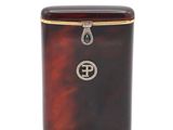 an antique tortoise shell tea caddy with a gold and diamond emblem