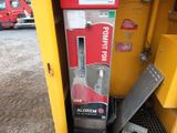 a machine that is sitting on the side of the road
