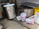 many containers and containers sitting on the counter in the kitchen