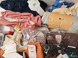 a box full of clothes and other items on a table