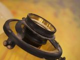 a close up of a yellow vase with a camera on it
