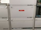 a lot of filing cabinets that are stacked up together
