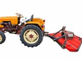 a tractor with a plow attached to the front of it